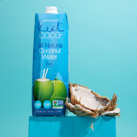 All Natural Coconut Water carton on blue background with fresh coconut