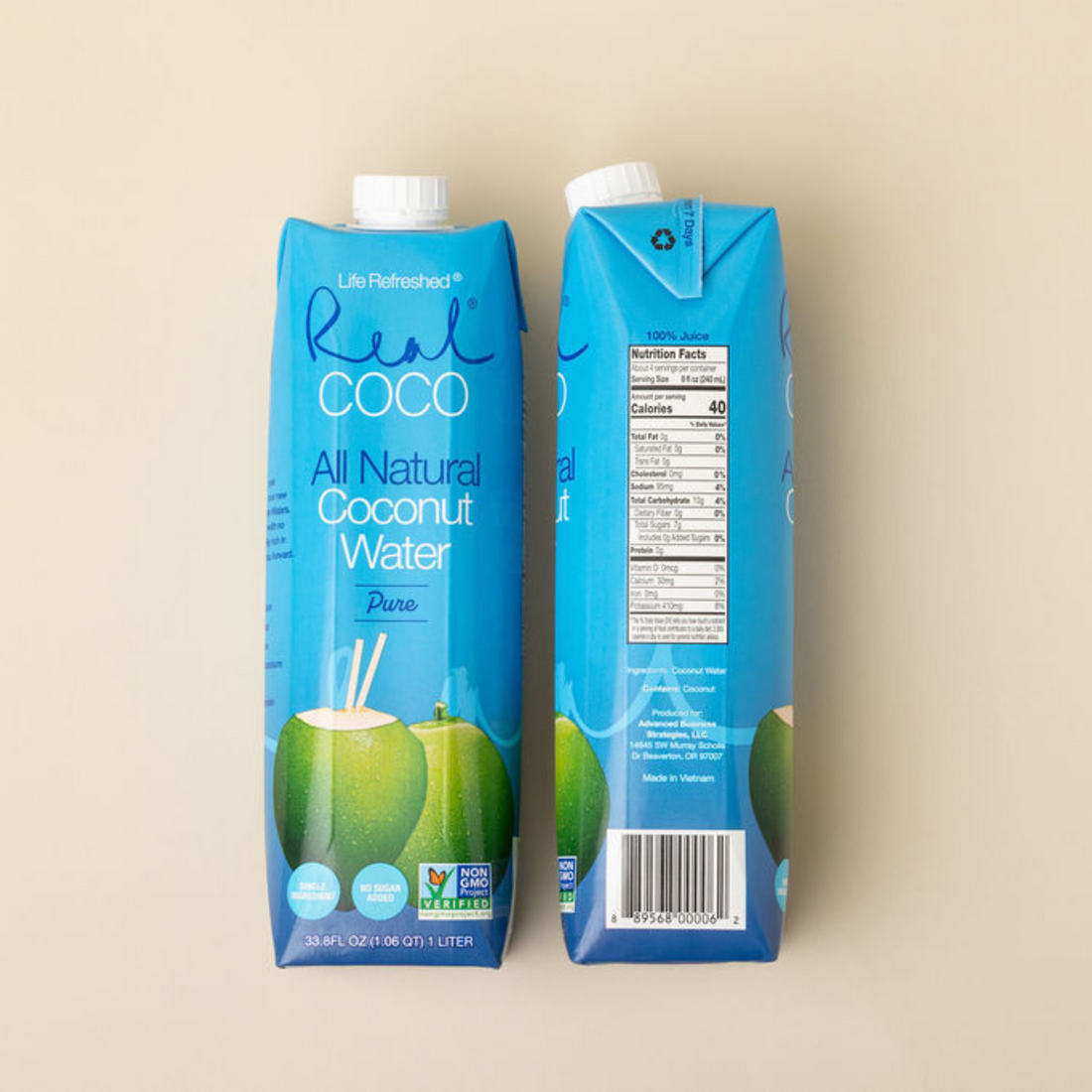 All Natural Coconut Water Pure cartons on a beige background
